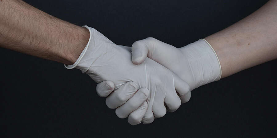 gloved hand shake