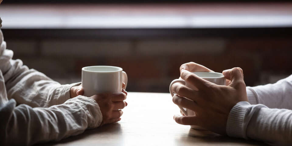hands with coffee cups