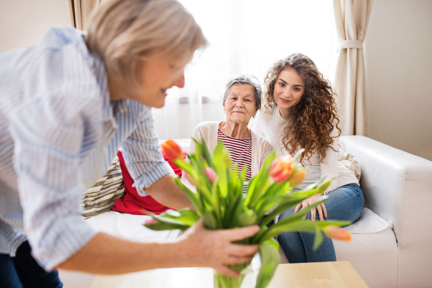 family in living room with tulips