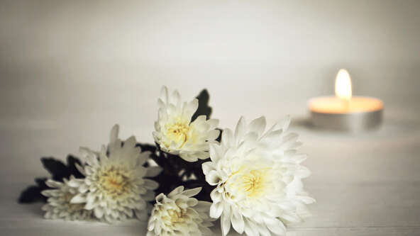 Candle-and-flowers.jpg?sw=592&cx=0&cy=0&cw=2500&ch=1407&q=60