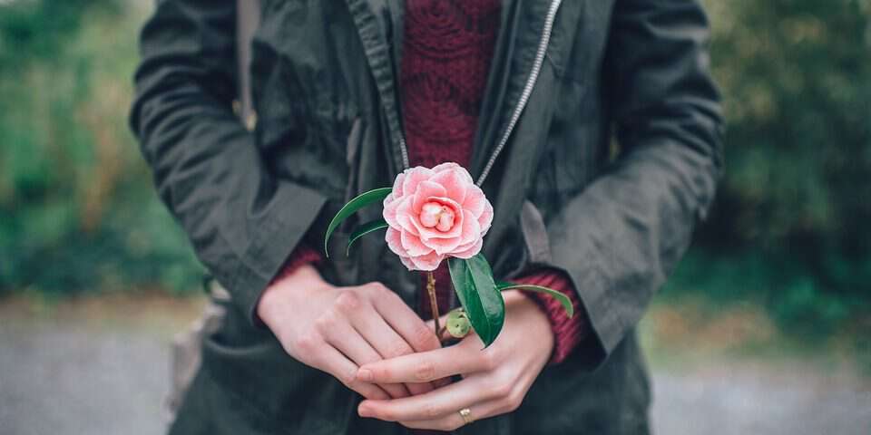 woman with pink flower
