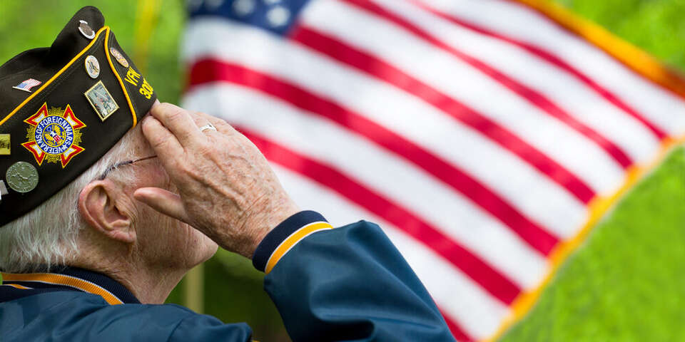 veteran saluting flag