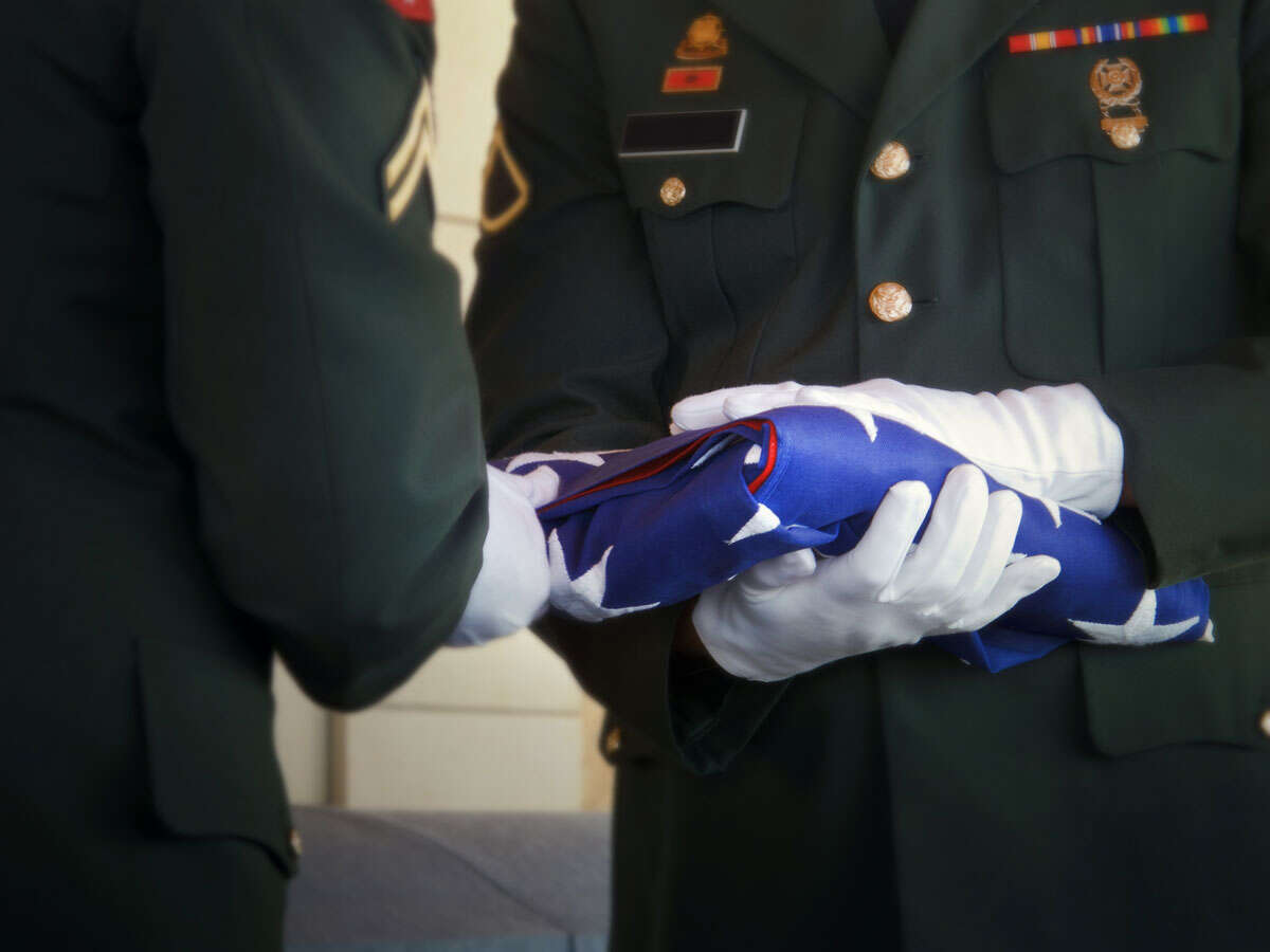 military handing over american flag