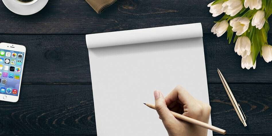 writing on pad of paper
