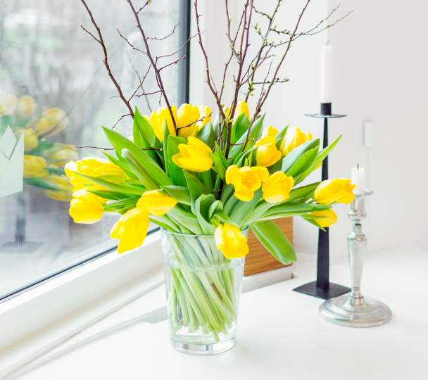 vase of tulips on table