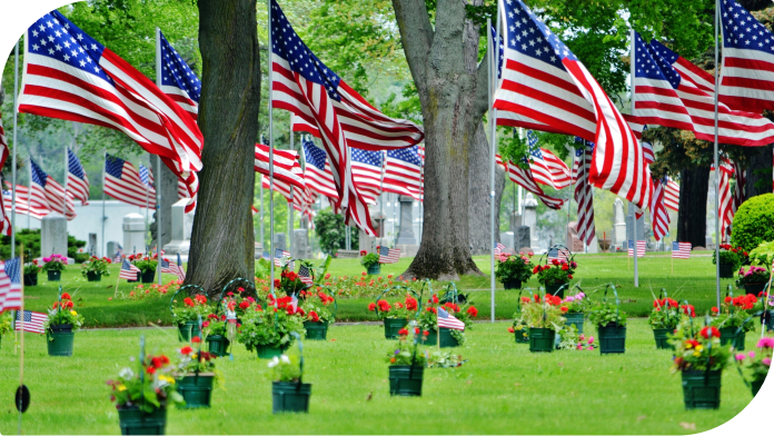 peaceful cemetery with waving american flags