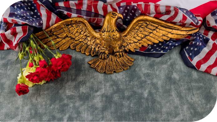 eagle memorial with roses and flag